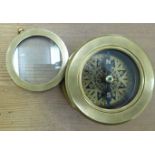 A modern lacquered brass compass,