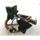An 'antique' silver and enamelled green ivy leaf and berry brooch 11