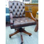 A modern stained beech showwood framed office desk chair with open arms,