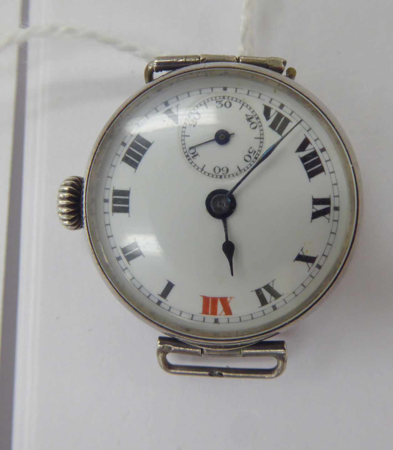 A lady's 'antique' round silver cased wristwatch,