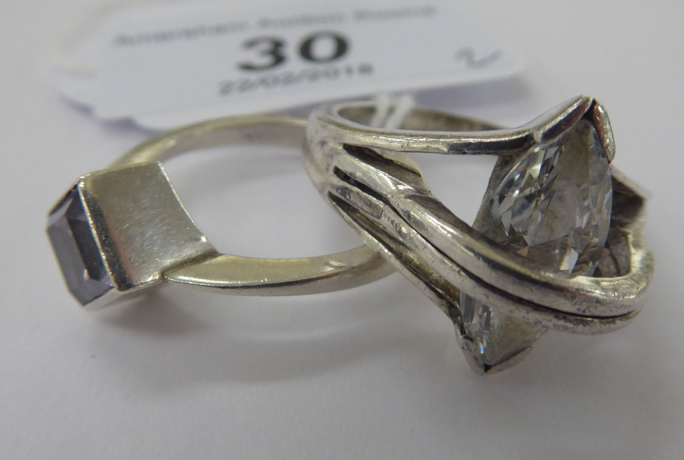 Two dissimilar silver coloured metal rings,