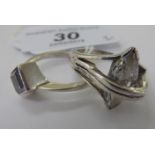 Two dissimilar silver coloured metal rings,