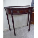 A modern mahogany finished semi-circular, serpentine front, two drawer console table,