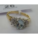 A 9ct gold claw set blue topaz and diamond ring 11