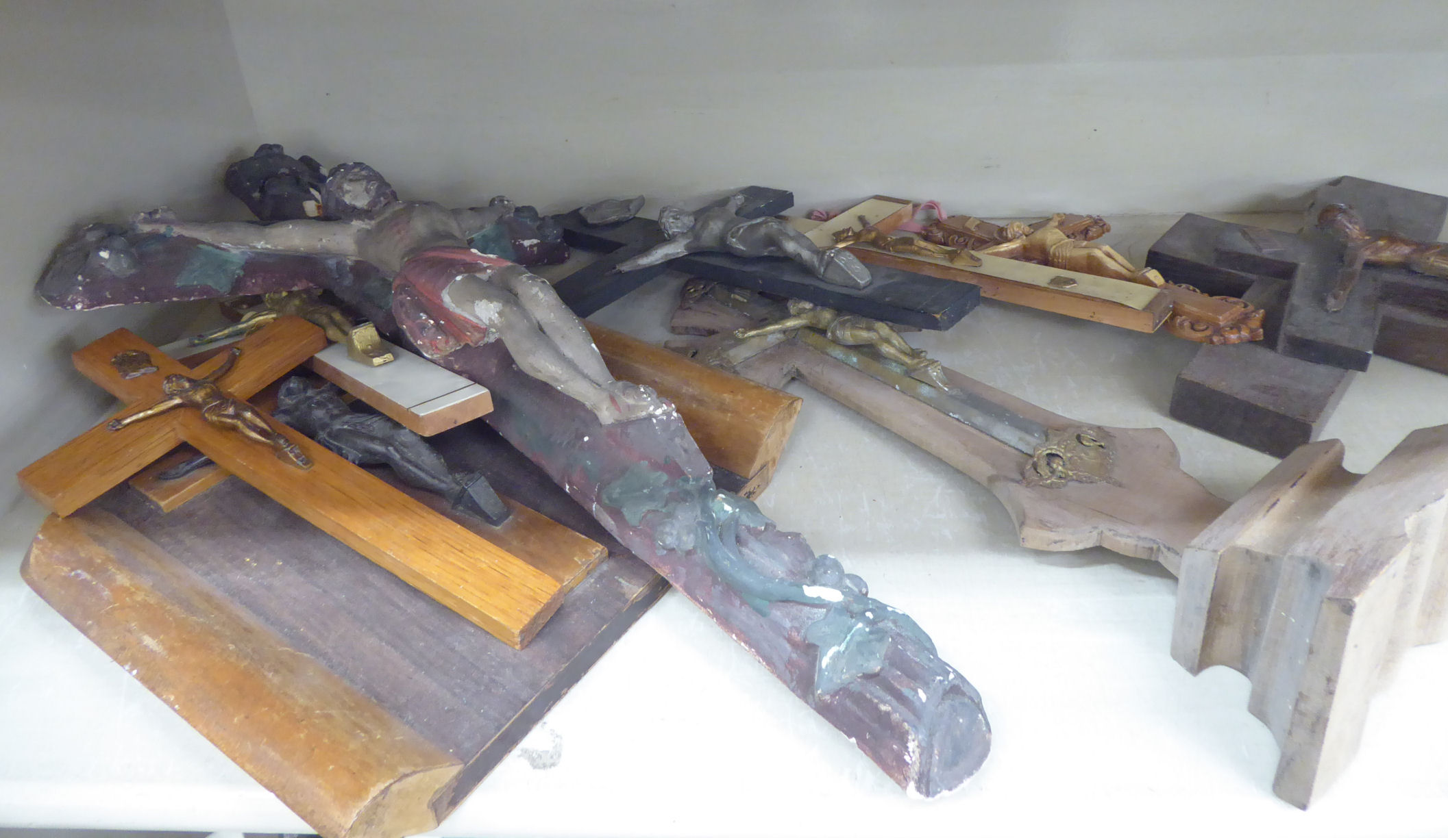 Approximately twenty 20thC crucifix of varying forms with cast metal, - Image 2 of 3