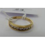 A 9ct gold diamond set half-eternity ring 11