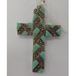 A silver coloured metal pendant cross with turquoise and marcasite ornament stamped 925 11