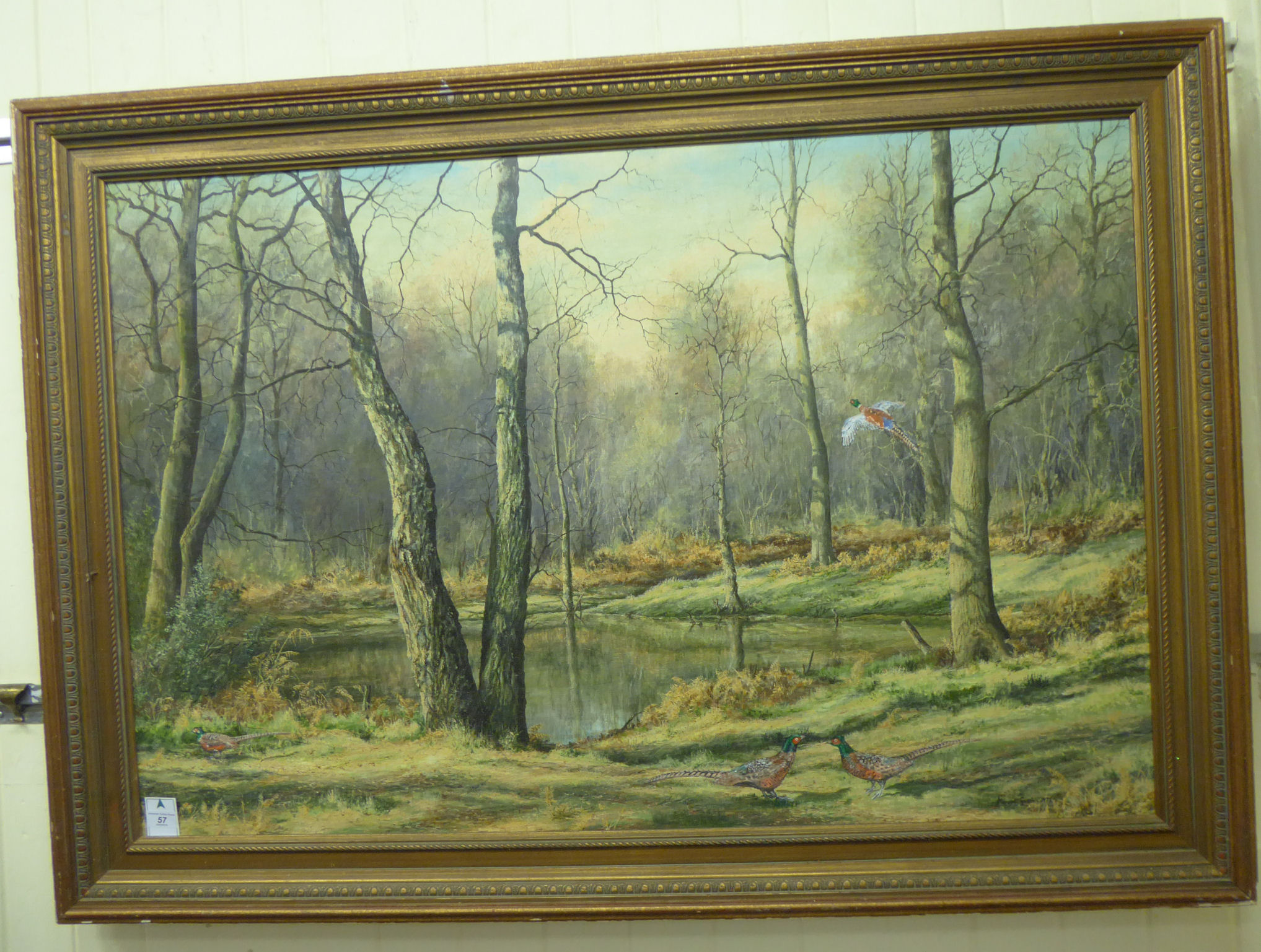 Mervyn Goode - a woodland scene with pheasants by a pond oil on board bears a signature & dated