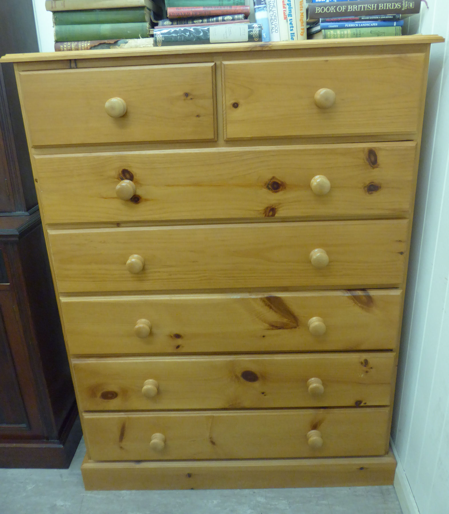 A modern honey coloured pine dressing chest,