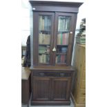 A late Victorian mahogany cabinet bookcase,