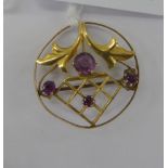 An 'antique' gold coloured metal framed, round brooch,