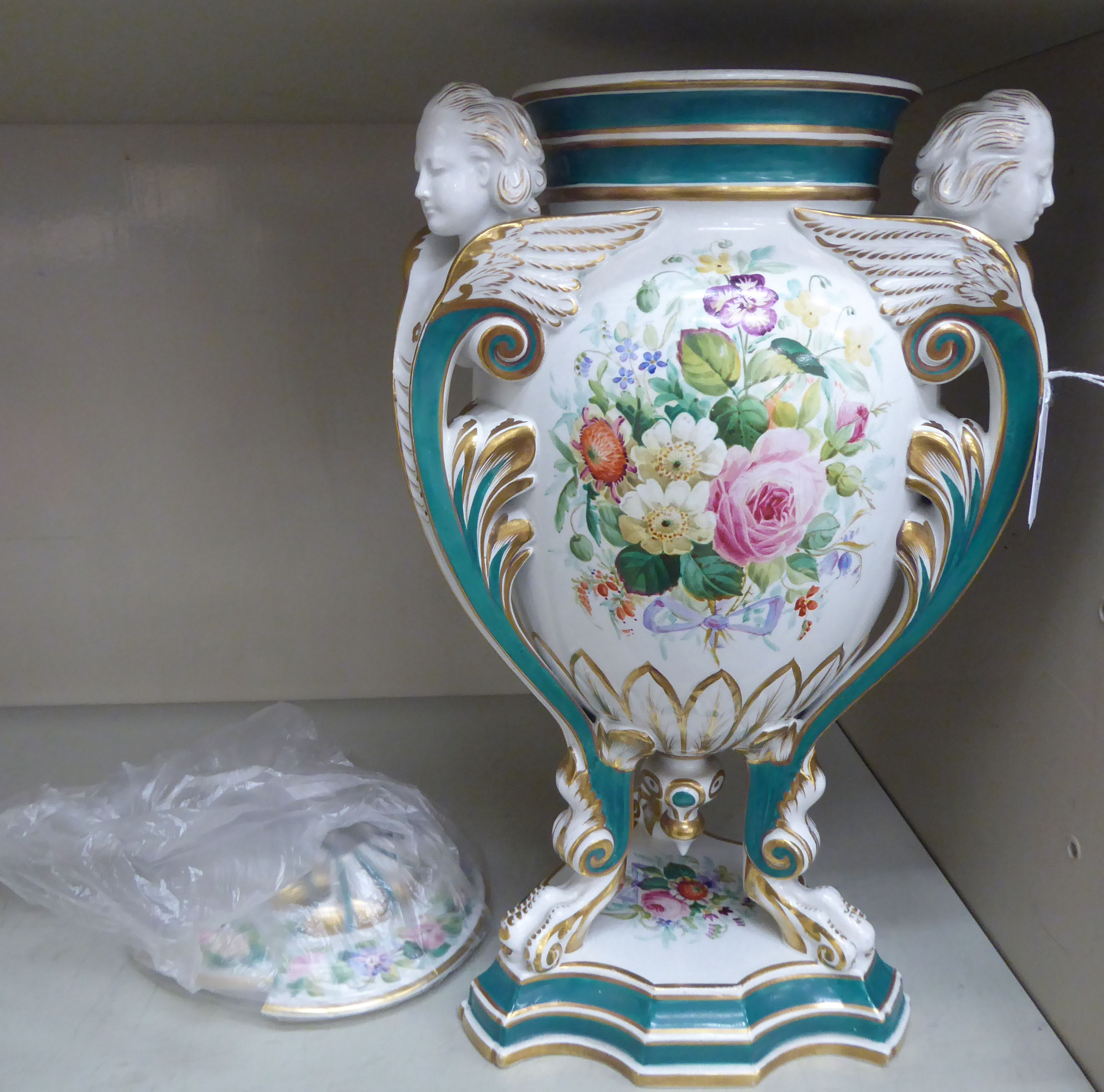 A mid 19thC Continental ovoid shaped china vase, decorated with flora,