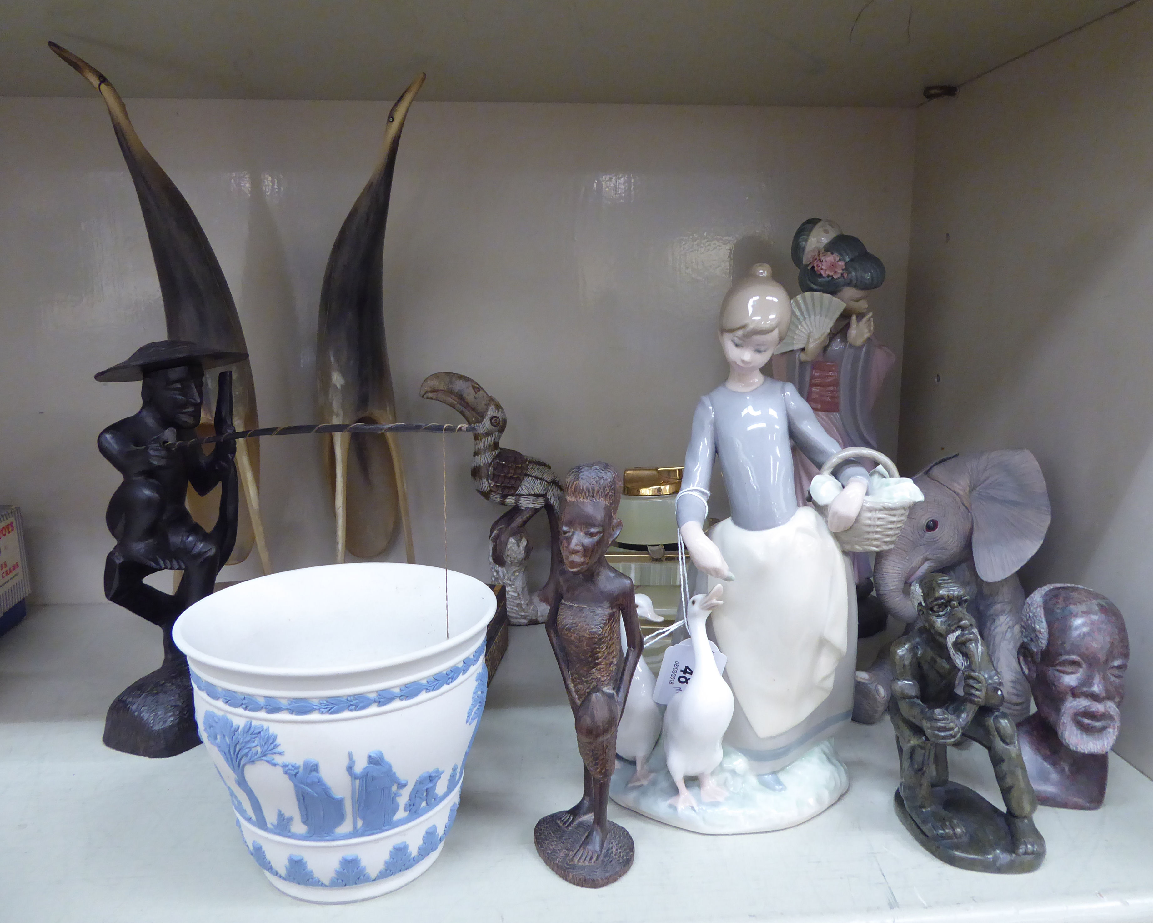 A mixed lot: to include a Lladro porcelain figure, a young Asian woman holding a fan 9.