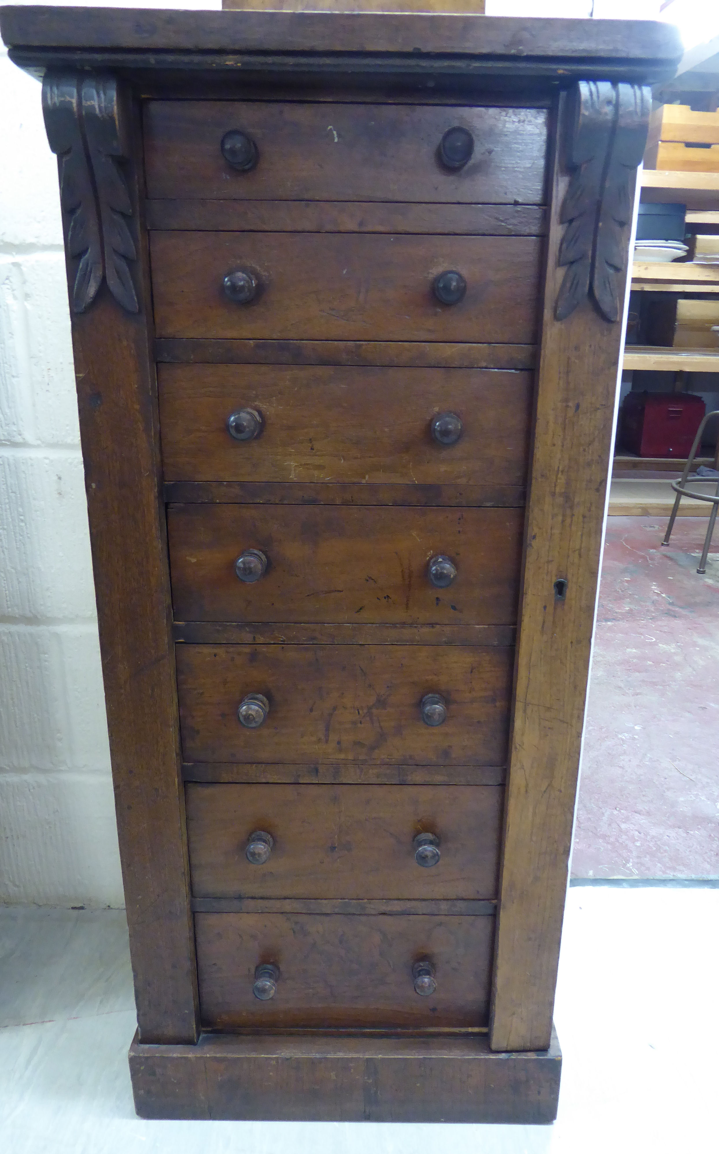 A mid Victorian mahogany Wellington chest with seven graduated drawers,
