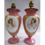 A pair of late Victorian moulded opaque pink glass pedestal vases,