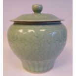 A 20thC Chinese celadon glazed porcelain pot of squat baluster form,