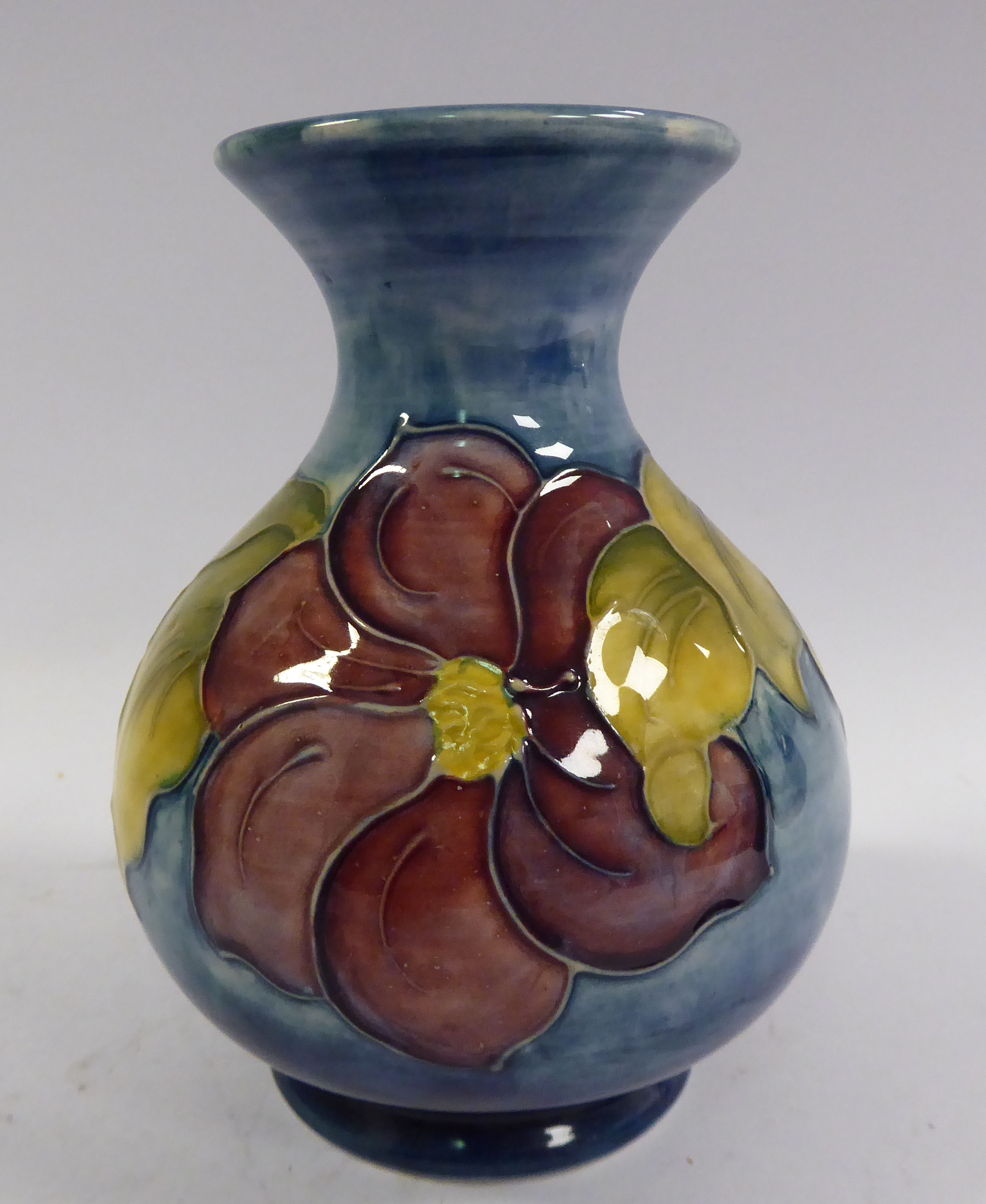 A Moorcroft pottery vase of bulbous form with a waisted neck and flared rim,