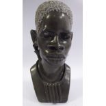 Nicholas Tandi - a carved black stone bust,