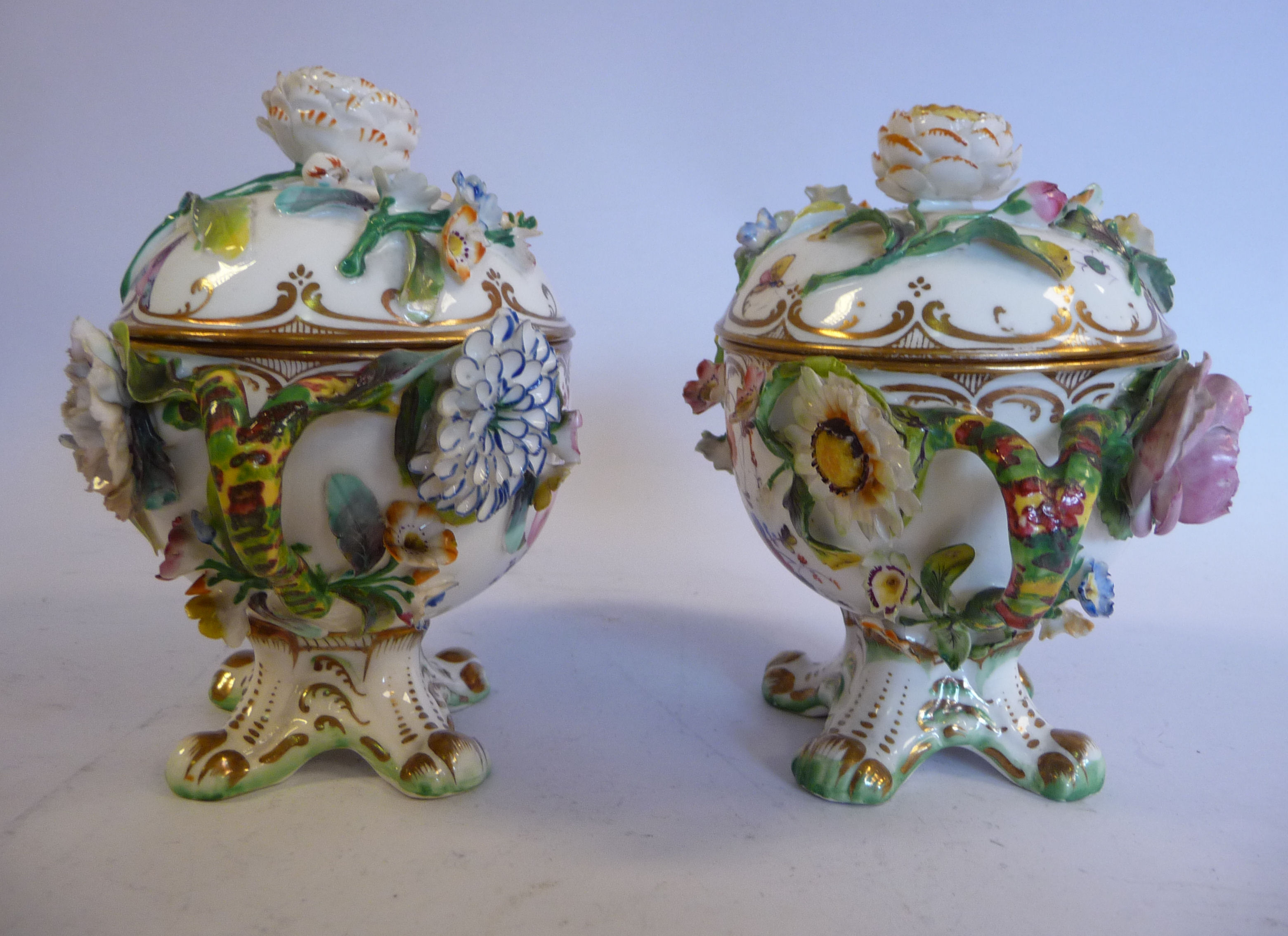 A pair of late 19thC floral encrusted porcelain, twin handled pots with domed covers, - Image 2 of 5