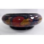 A Moorcroft pottery footed bowl of shallow, bulbous form,