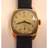 A 1940s Rolex 9ct gold square cased wristwatch, faced by a silvered,