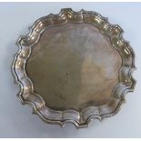 A George III silver waiter with a raised piecrust border,