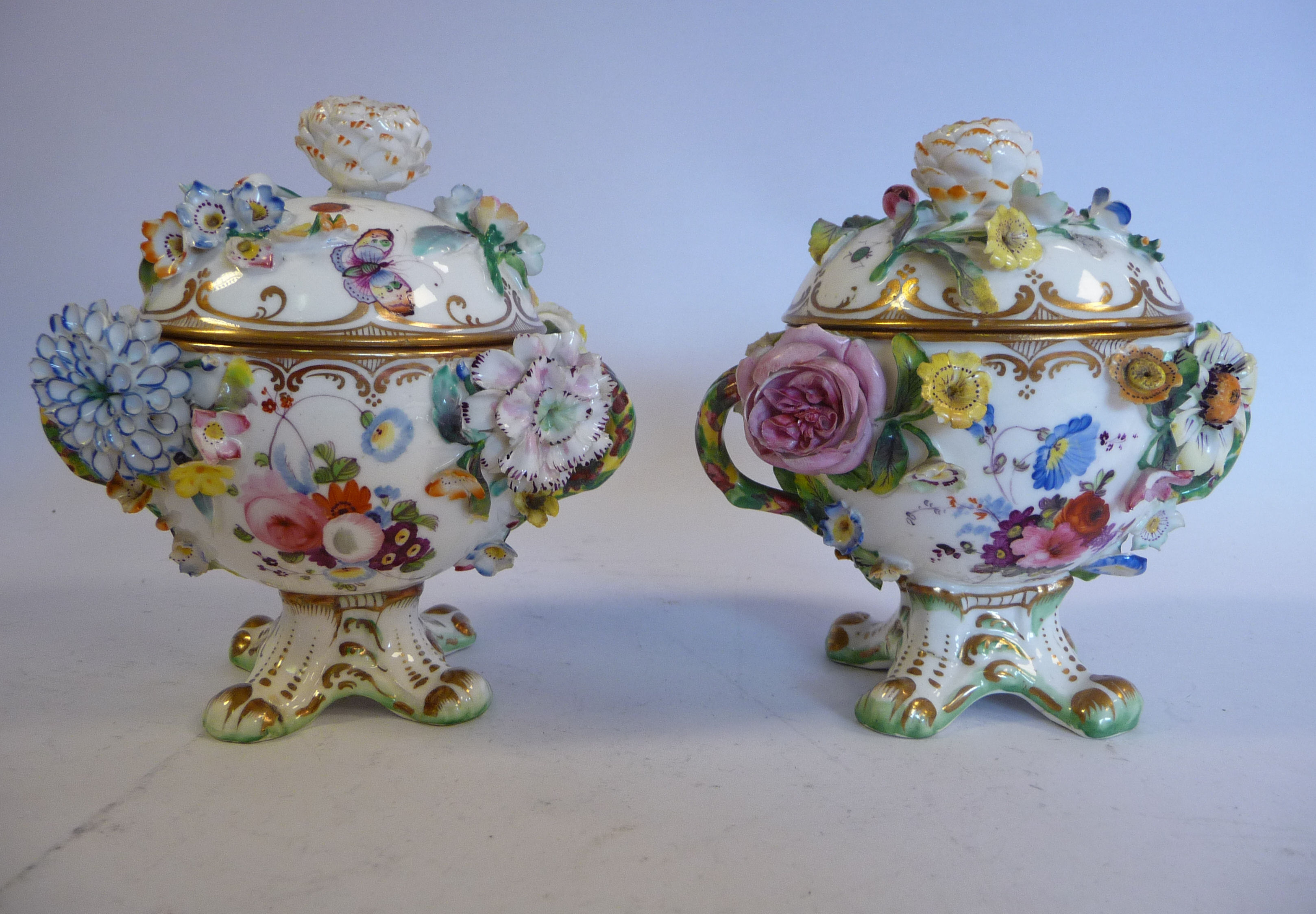 A pair of late 19thC floral encrusted porcelain, twin handled pots with domed covers, - Image 3 of 5
