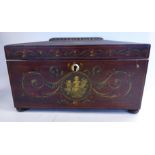 A Regency rosewood tea casket of sarcophagus form with bead carved ornament on the lid and allover