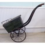 An early 20thC child's (or retailer's display) baker's, two wheeled delivery cart,