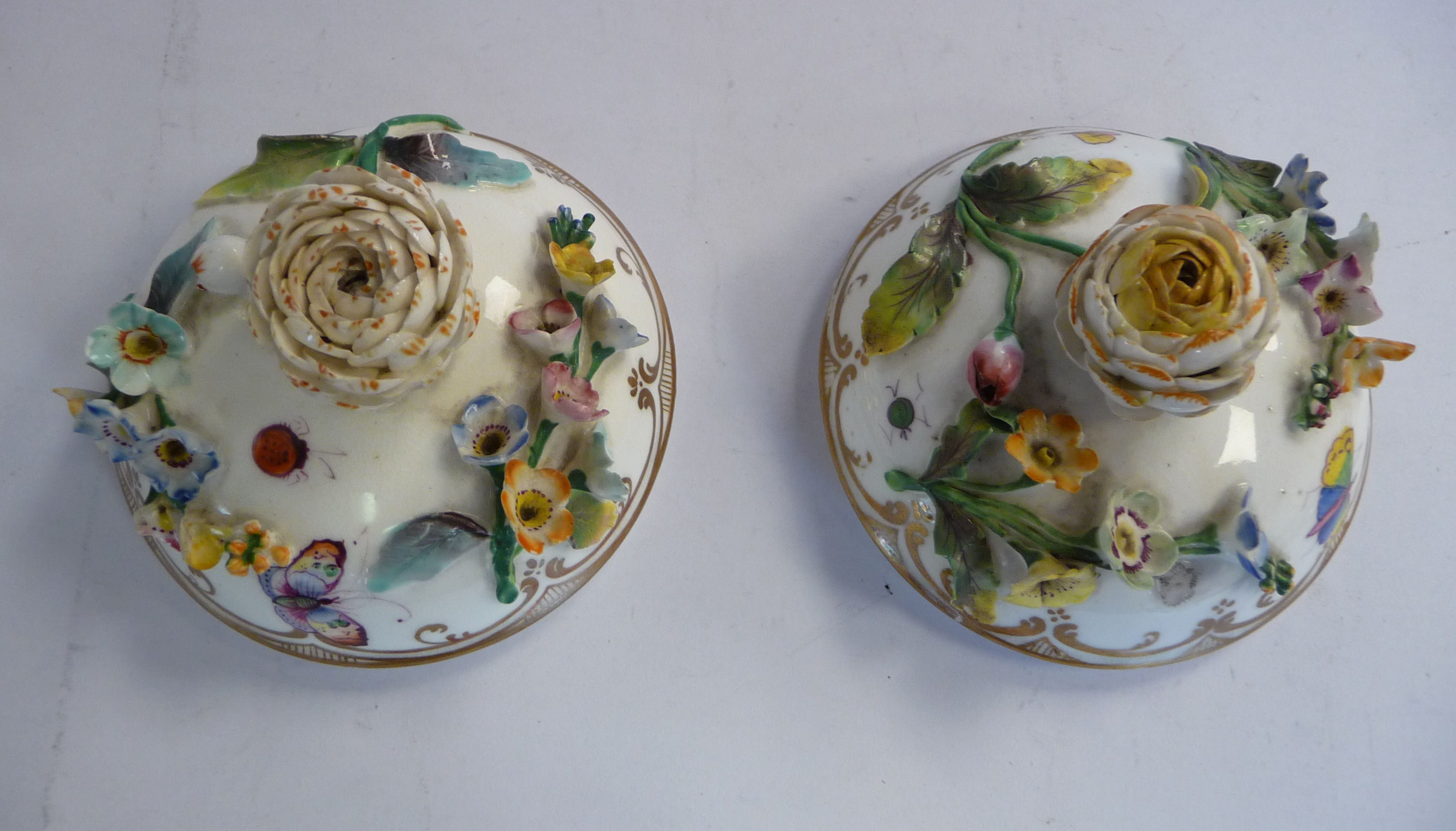 A pair of late 19thC floral encrusted porcelain, twin handled pots with domed covers, - Image 4 of 5