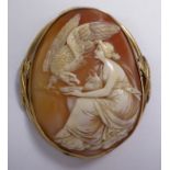 An oval shell carved cameo brooch, featuring a seated classical maiden and an eagle,