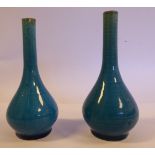 A pair of late 19thC Chinese porcelain miniature turquoise glazed bottle vases with long,