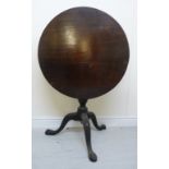 An early/mid 19thC mahogany tip-top pedestal table, over a ring turned column,