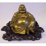 A 19thC Chinese cast bronze figure, a seated Buddha,