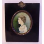An early 19thC oval profile portrait miniature,
