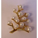 An 18ct gold tree design brooch,