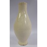 An 18thC Chinese cream glazed earthenware ovoid shaped, footed vase,