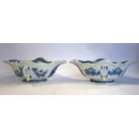 A pair of Chinese porcelain sauce dishes of oval form with opposing, pouring lips and handles,