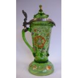 An early 20thC Continental semi-opaque green glass tankard of tapered cylindrical form with a drawn