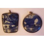 Two Chinese silver coloured metal framed pendants,