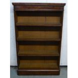 A late Victorian walnut four tier, open front bookcase with round corners,