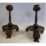 A pair of early 20thC Arts & Crafts spot-hammered bronze finished iron candlesticks with