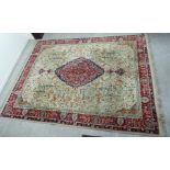 A Persian carpet with a central diamond motif, bordered by stylised animals,