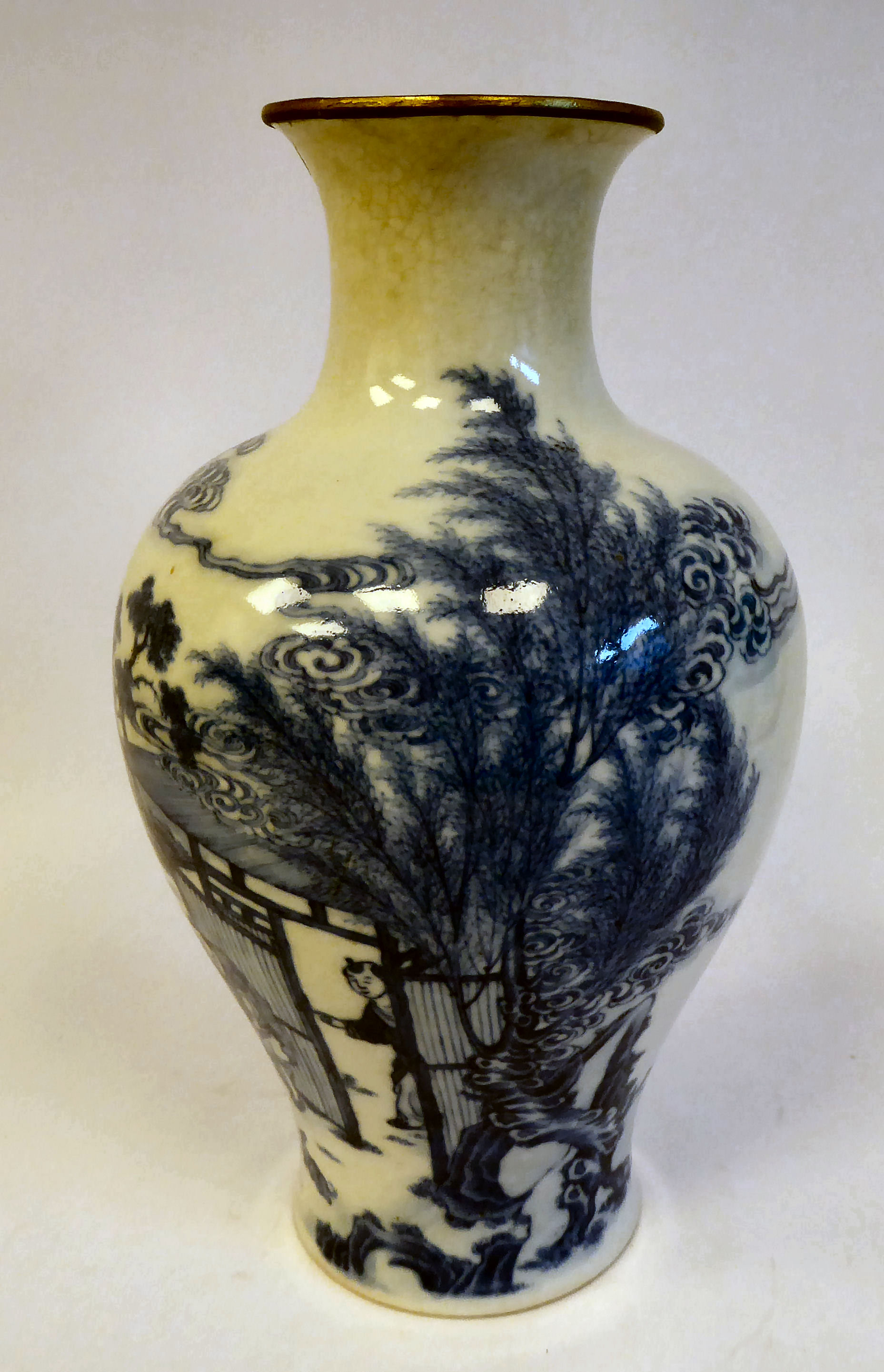 An 18thC Chinese porcelain vase of waisted baluster form with a narrow neck and flared rim,