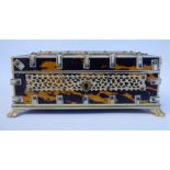 A 20thC jewellery casket, overlaid in tortoiseshell, fretworked and engraved,