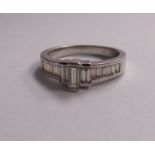 An 18ct white gold half-eternity ring,