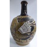 A late 19th/early 20thC Japanese two-tone brown glazed earthenware bottle vase with a narrow,