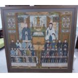 A Chinese ancestral group portrait, featuring two principal seated figures and before them,