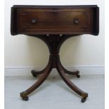 An early 19thC ebony string inlaid and crossbanded mahogany sofa table with an end drawer and a