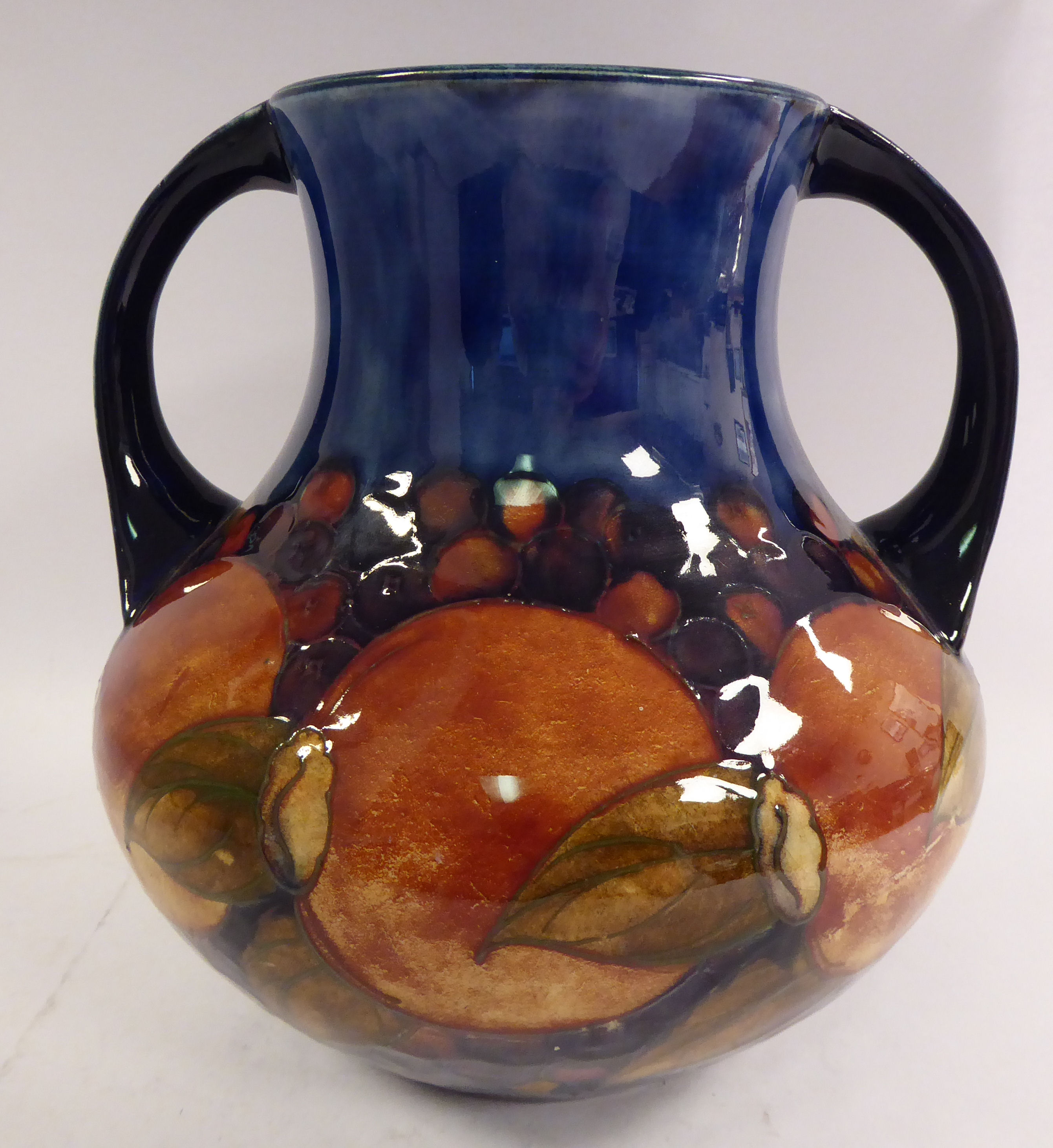 A Moorcroft pottery vase of squat, bulbous form, having a wide,